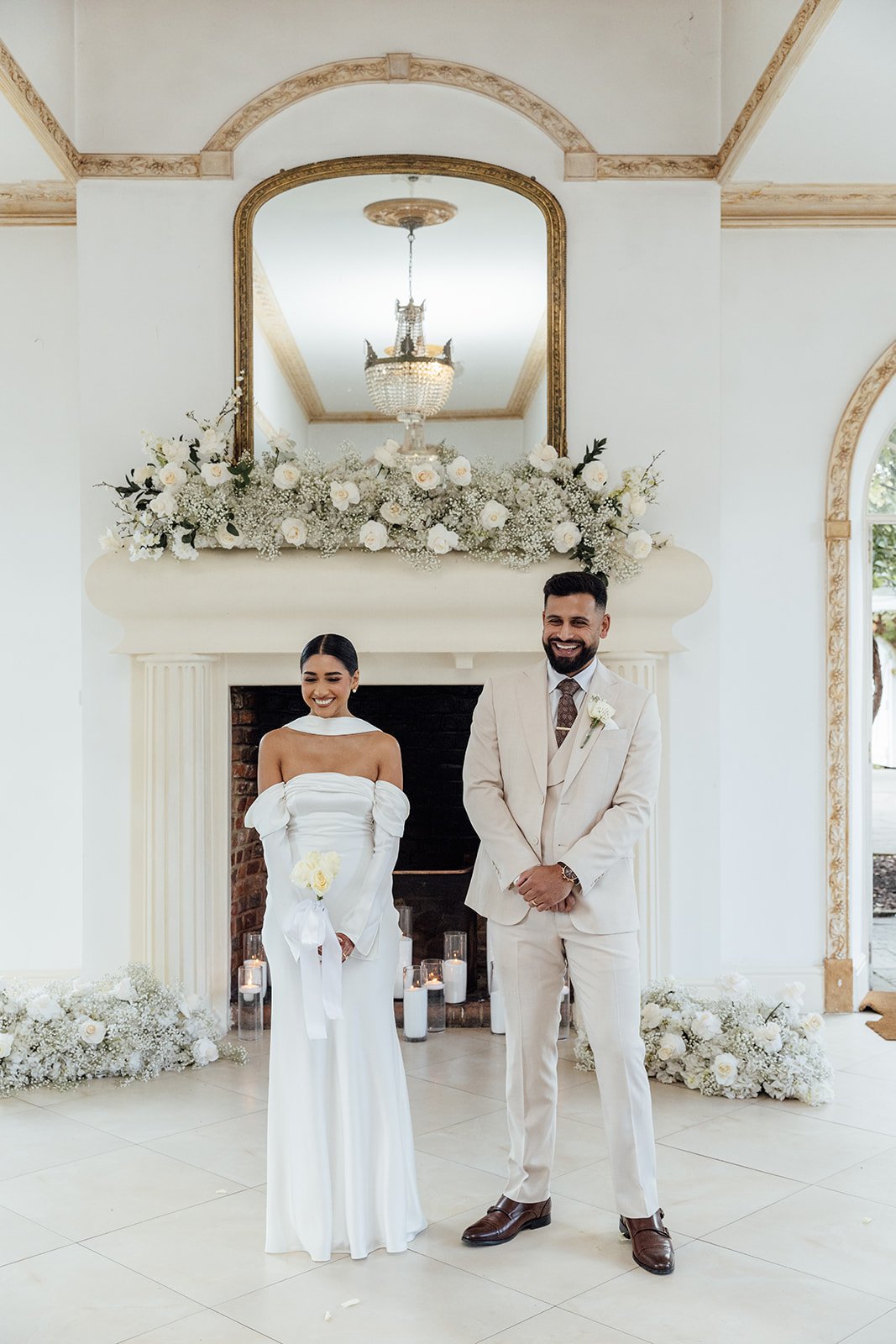 Elegant white wedding flowers featuring roses, gypsophila and hydrangeas at Northbrook Park.