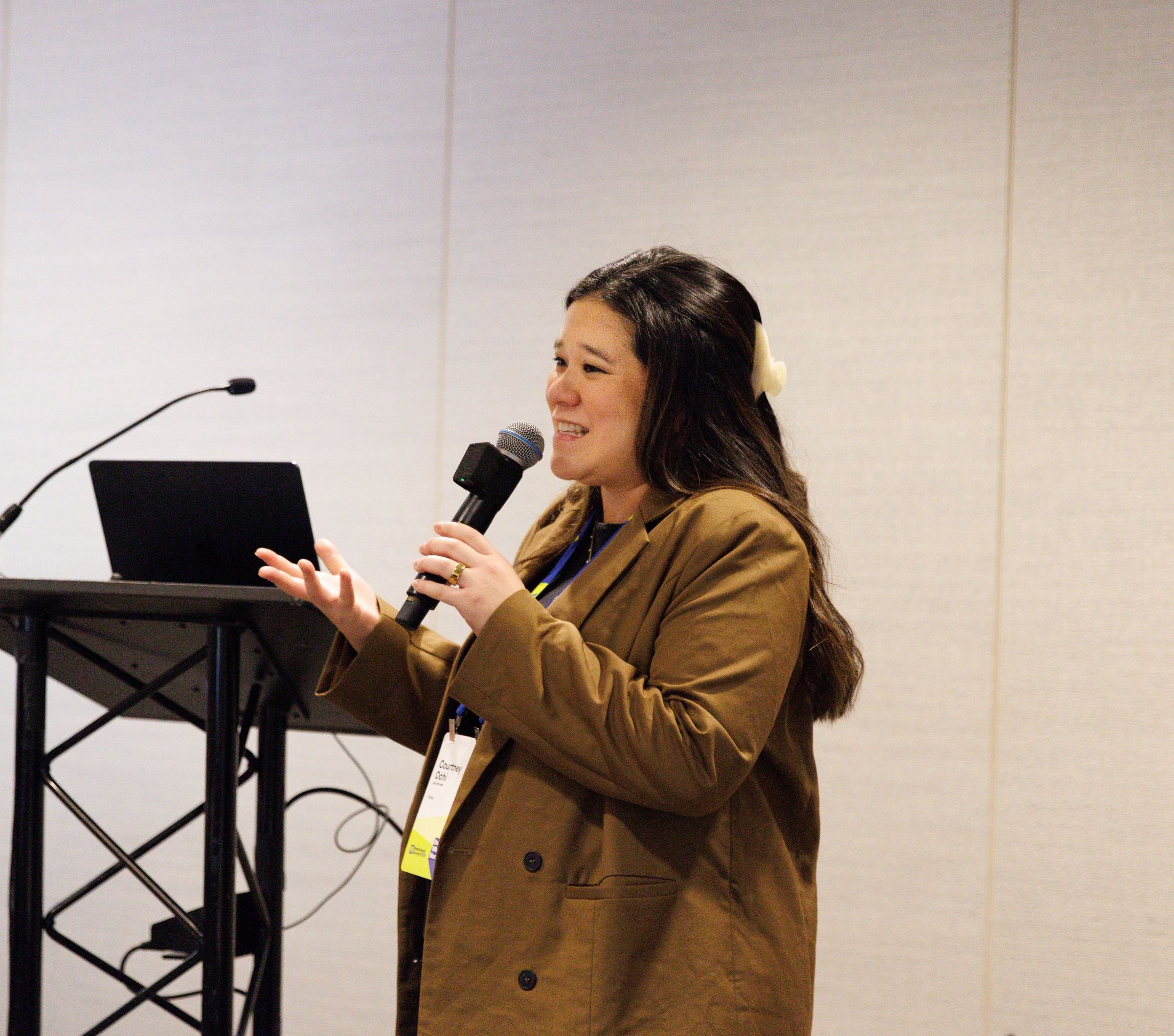 Thrive senior director speaking to educators and funders at a nonprofit reflection event at the Hilton San Francisco Union Square