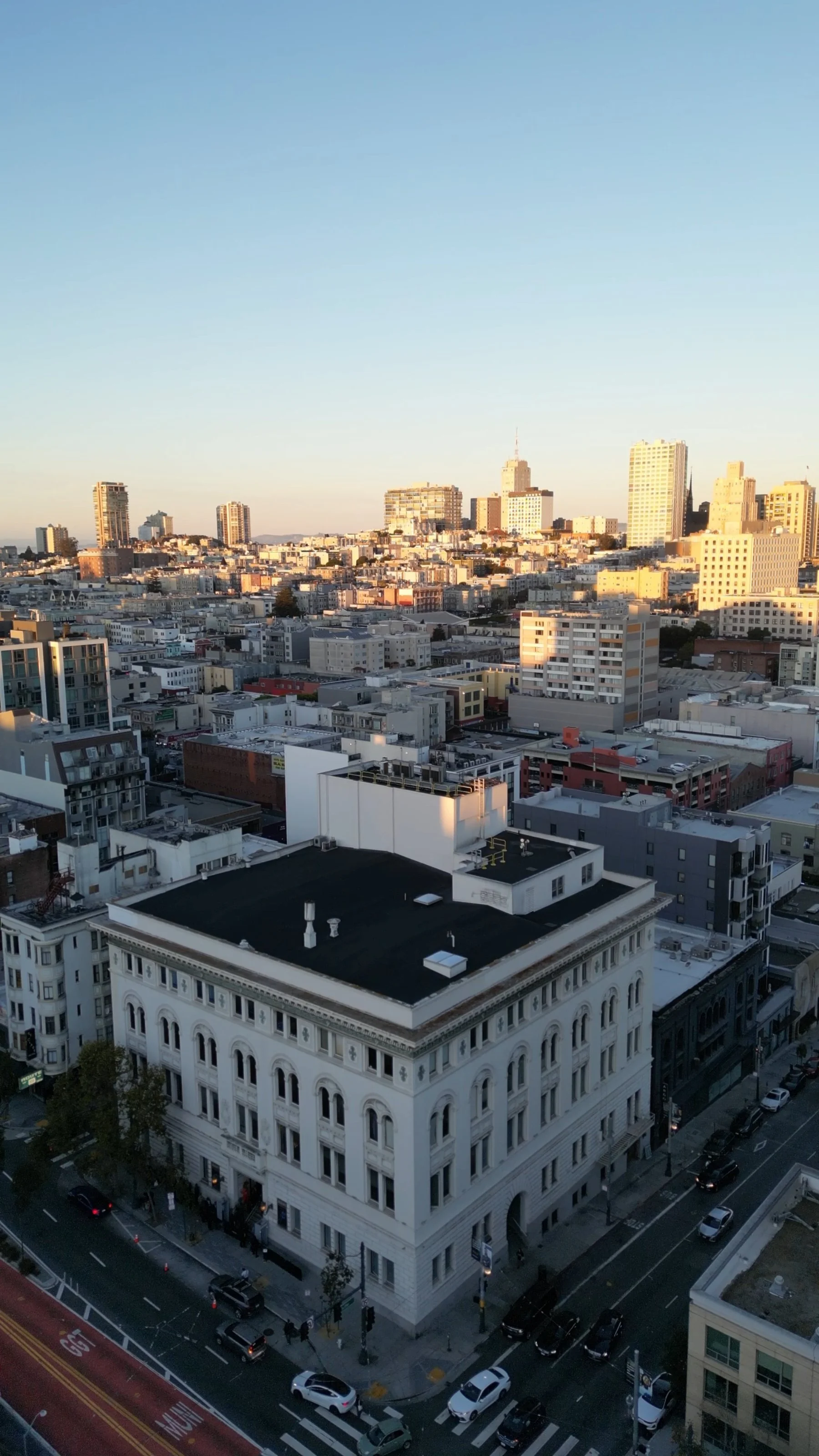 Golden hour drone shot of a San Francisco event venue and skyline by Kasey Bruce Media