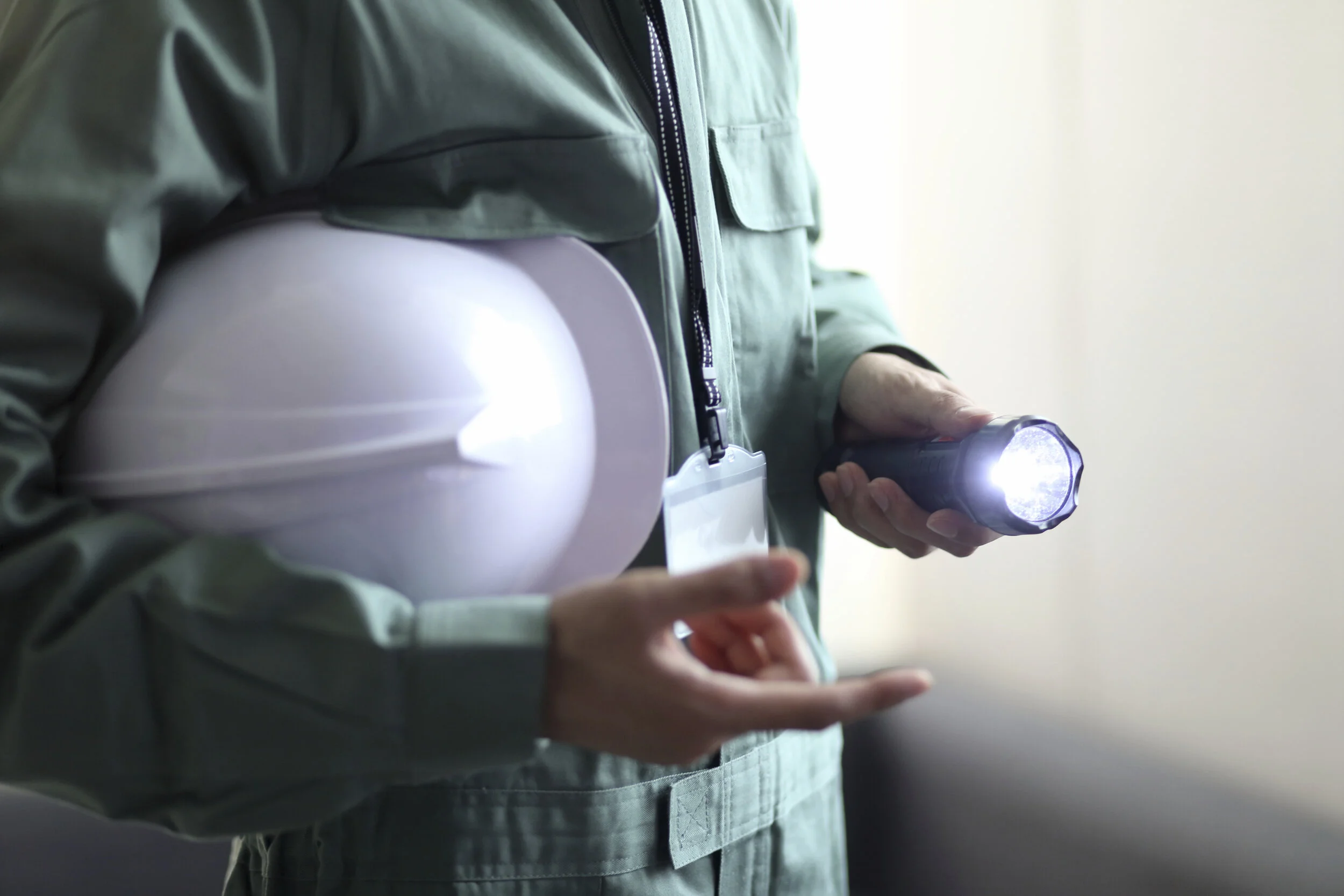 pest management professional with flashlight -shutterstock_1840492159.jpg