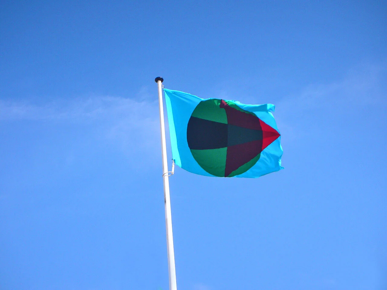 Flag. Installation, tattoo, flag. Rotterdam Vlaggenparade + Newcastle Upon Tyne. 2007.I raise the flag of independence, as any human can.   In coloured fabric; the international size; I could tell you what each shape means,  But I’ve tried to forget…