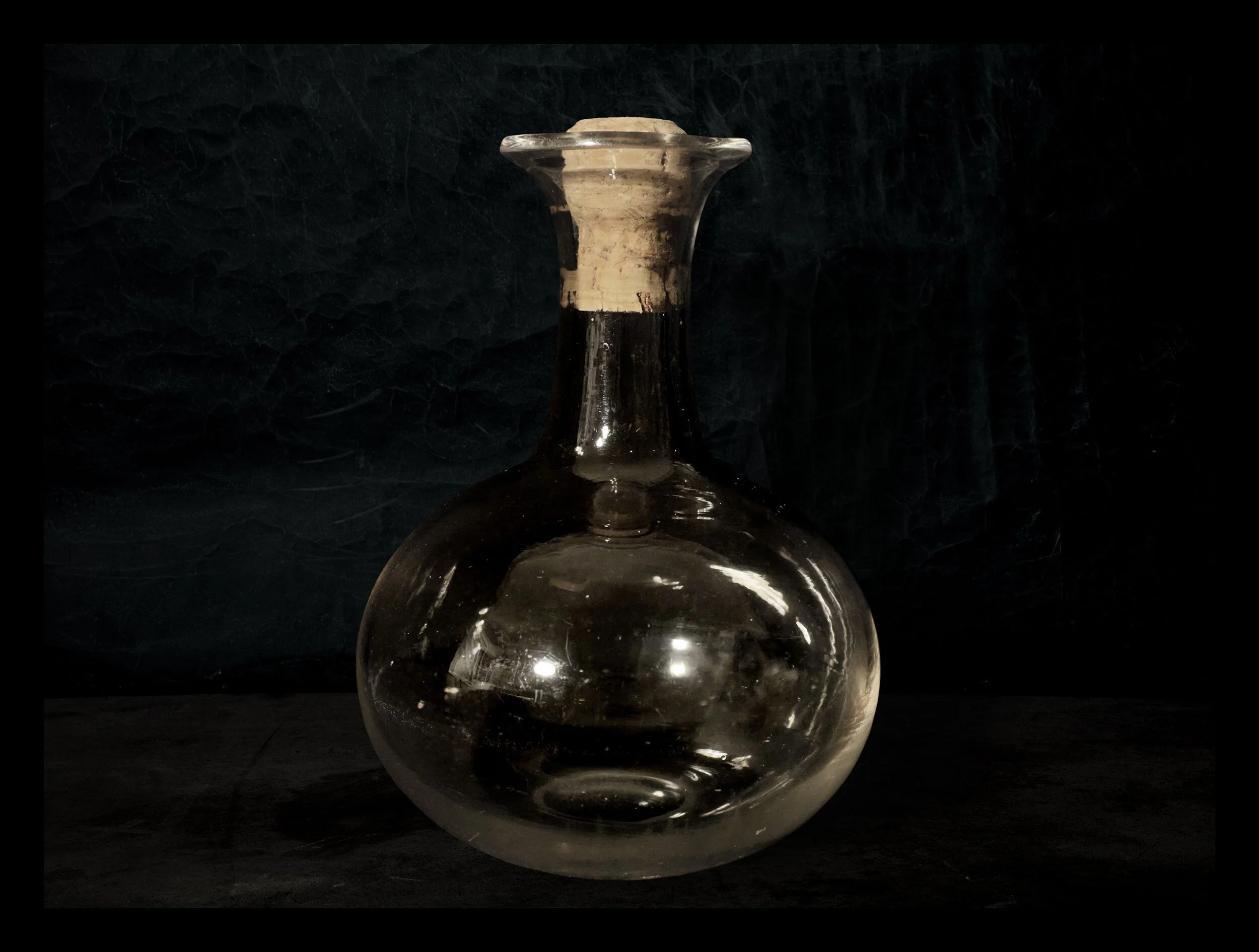 Atoms of Our Ancestors. Handblown glass container, cork, atoms. 2021.