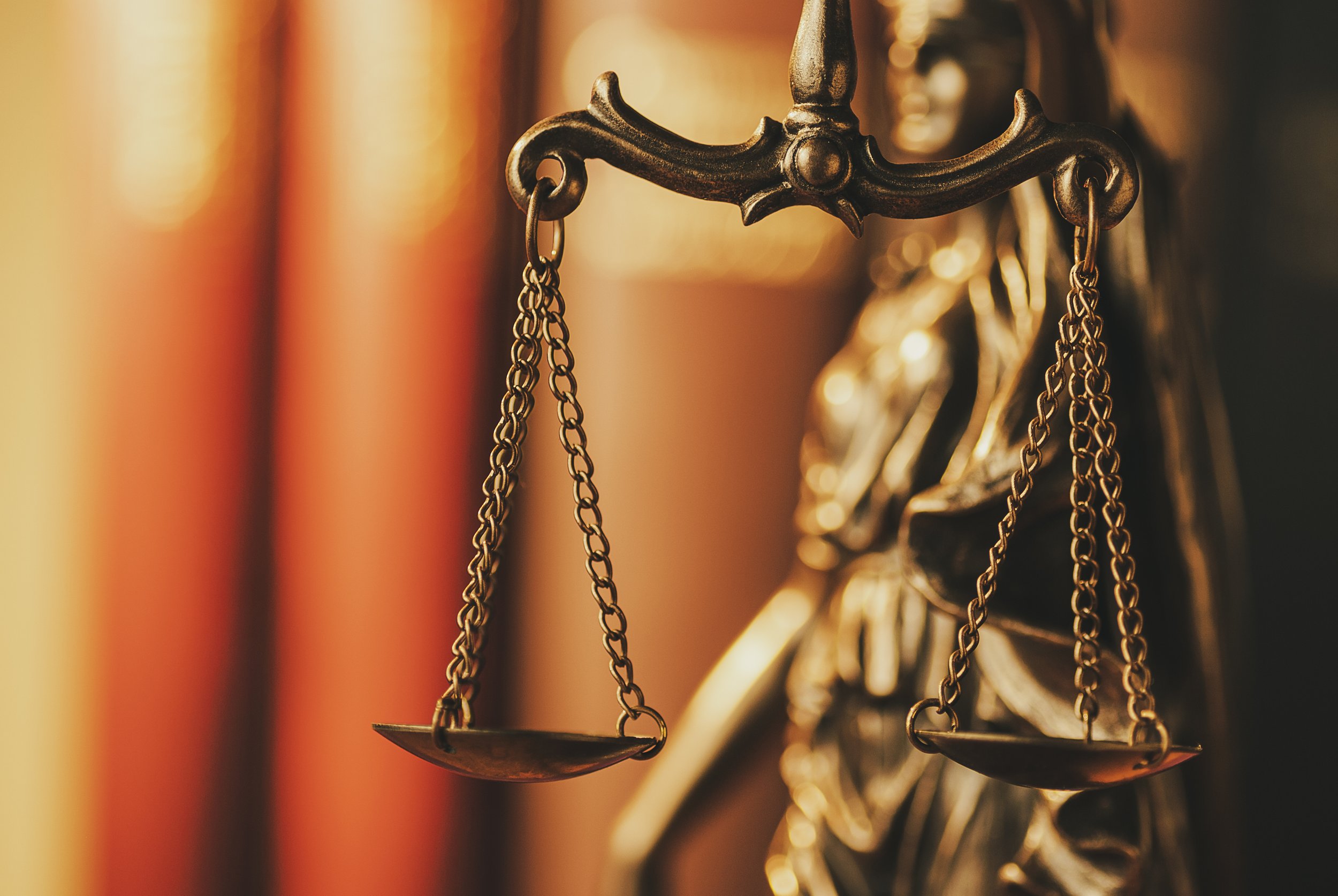 brass-scales-of-justice-in-a-close-up-view-2022-12-16-12-33-51-utc.jpeg