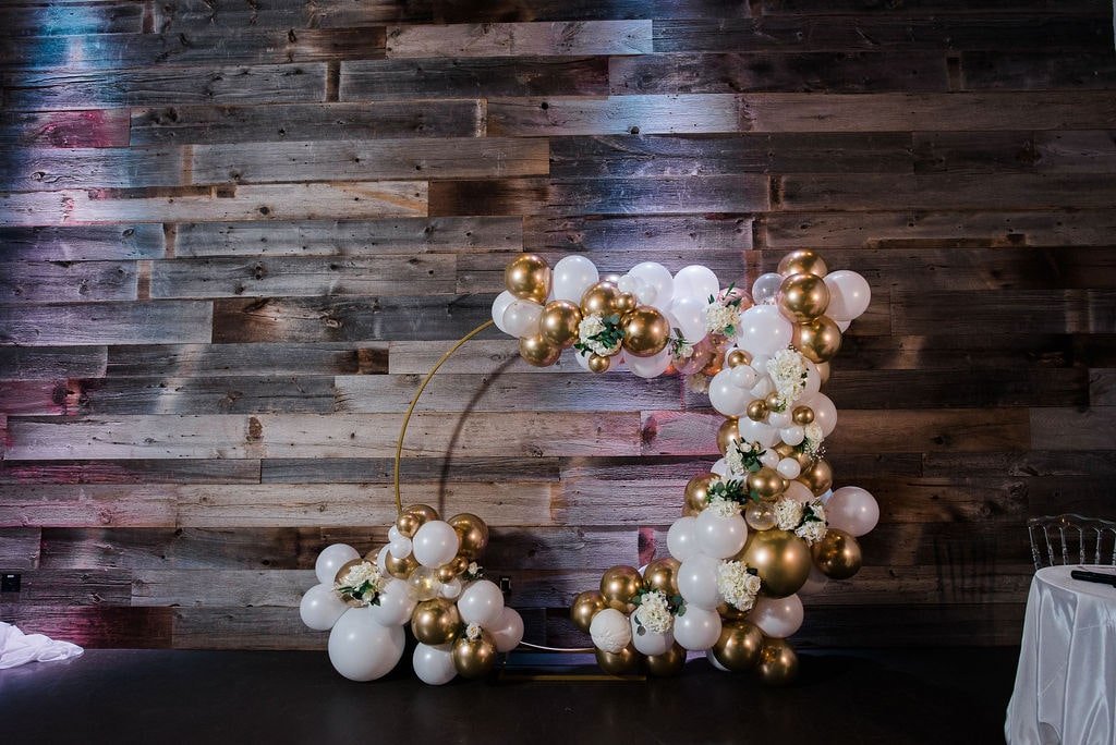 Gold and white balloon wedding arch