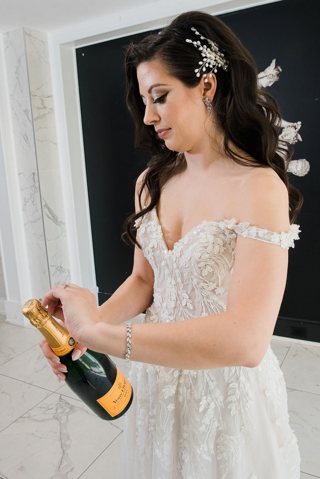 Bride popping champagne