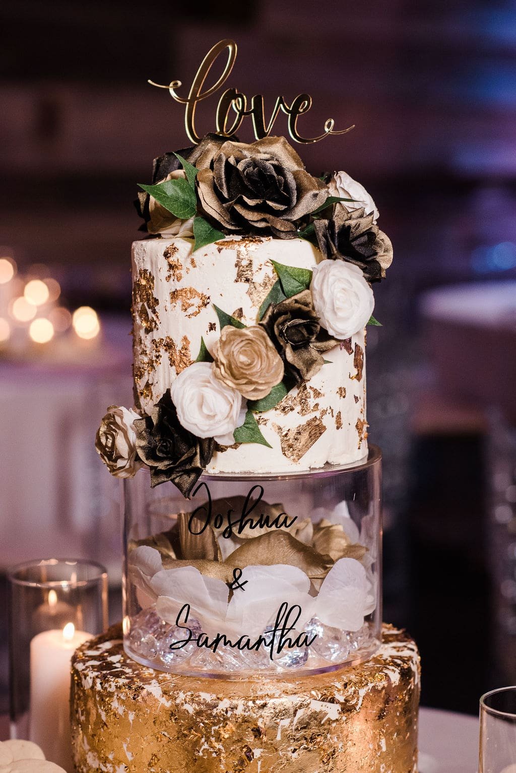 Three tiered gold and white wedding cake