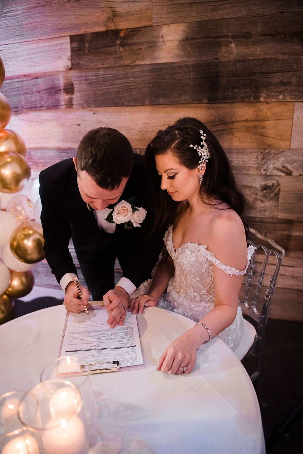 Toronto bride and groom signing marriage license 