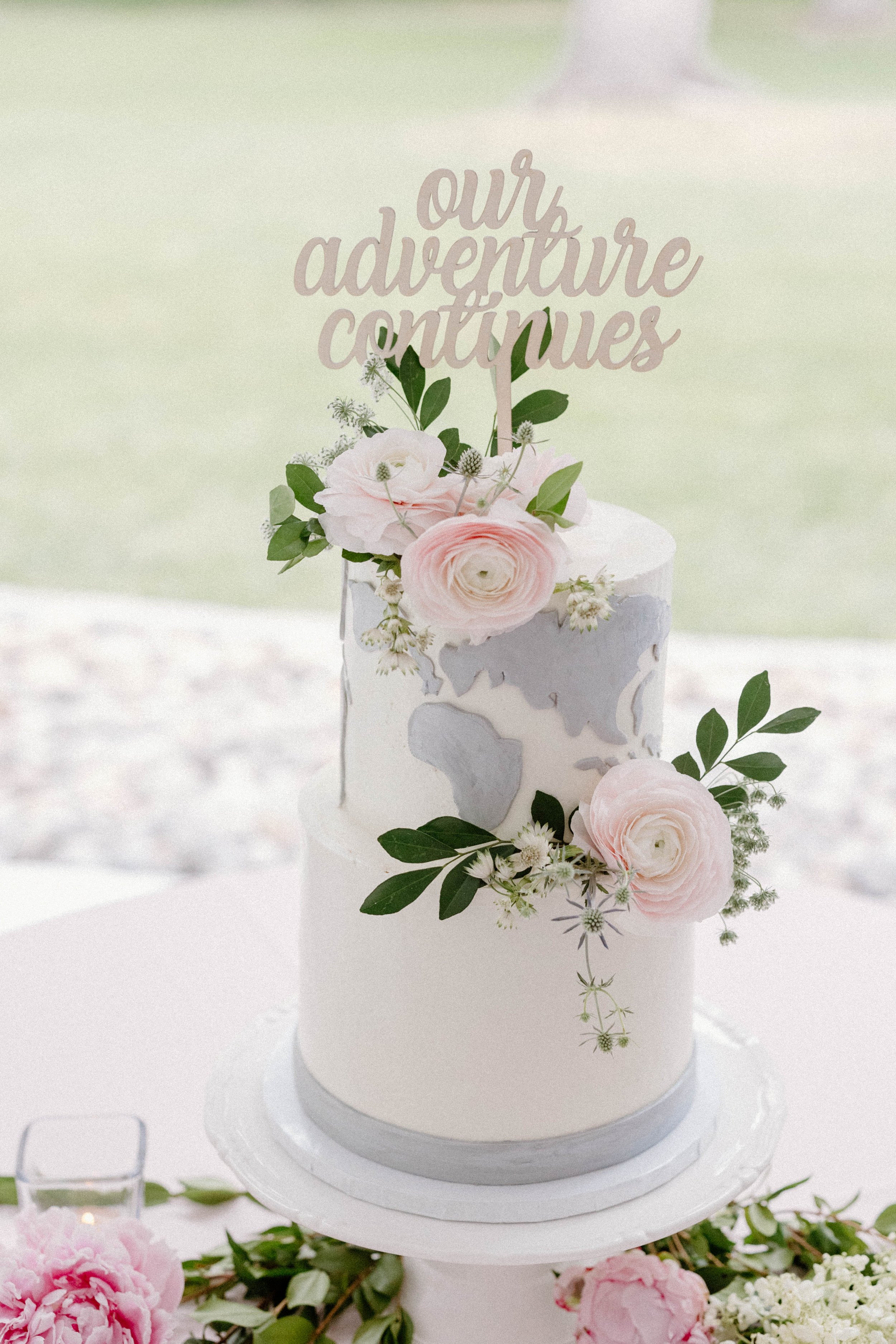 Wedding cake with adventure cake topper