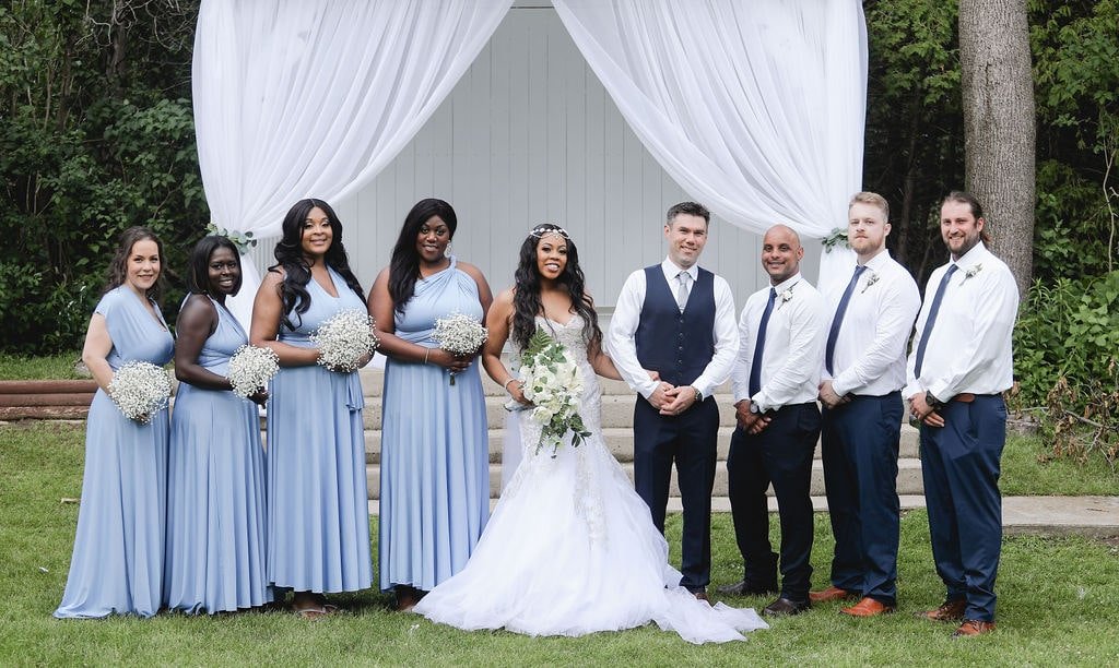 Wedding party in blue dresses &amp; blue suits