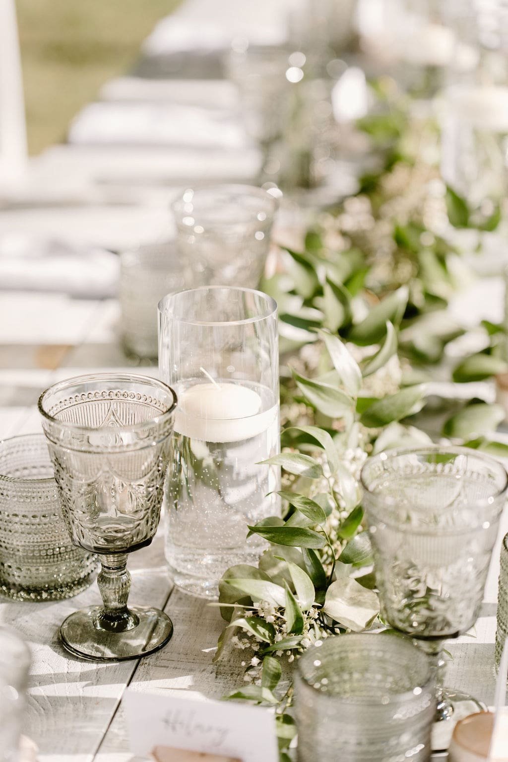 Greenery wedding table runner with floating candles