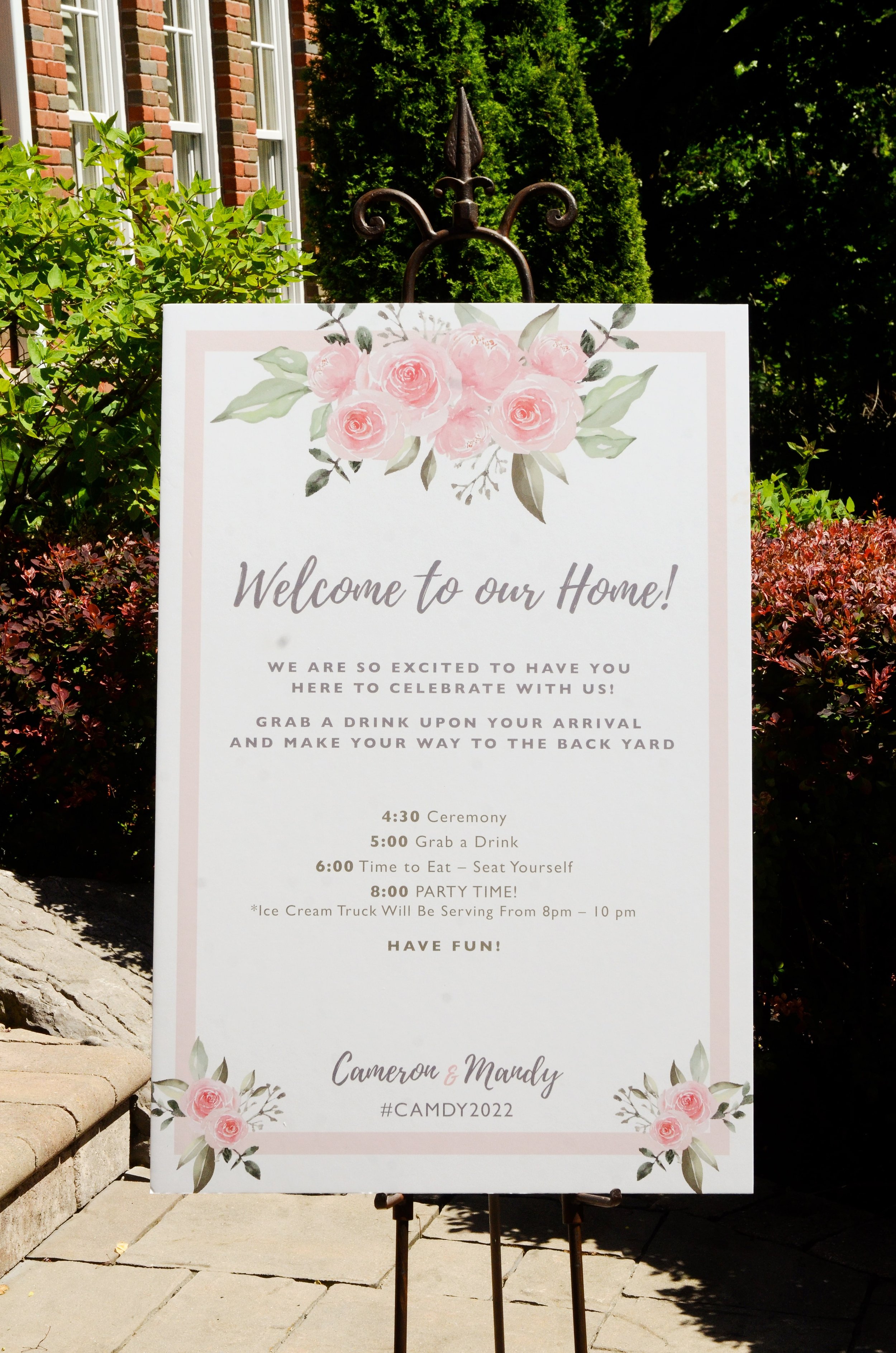 wedding welcome signage with pink flowers