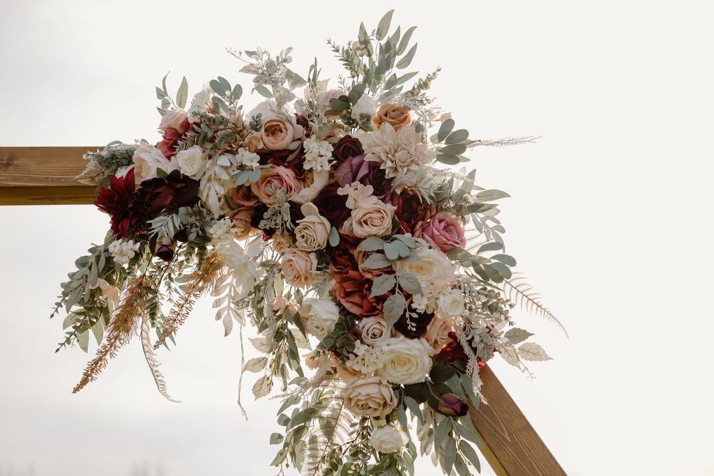 Wood wedding arch with flowers
