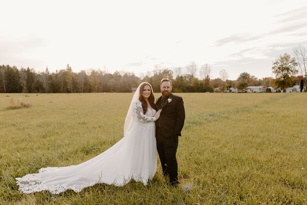 Bride and groom portraits in a field