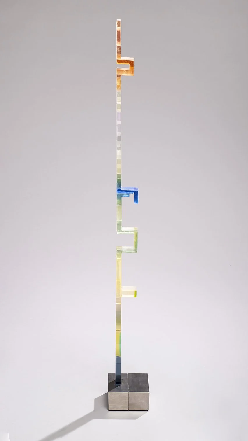 Kujenga 12 (44 ¼” H  x  2 ½” W x 1 ¾” D) set in a brushed stainless steel base (6” W x 6” D x 3” H)