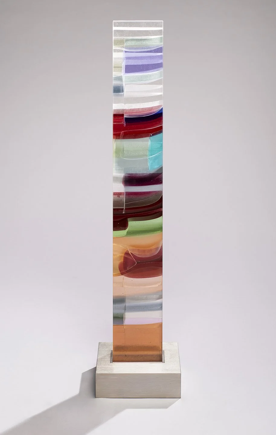 Spire 10 (43 1/2”H x 6” W x 2 5/8”D) set in a brushed stainless steel base (3”H x 9 3/4"W x 7 3/4” D)