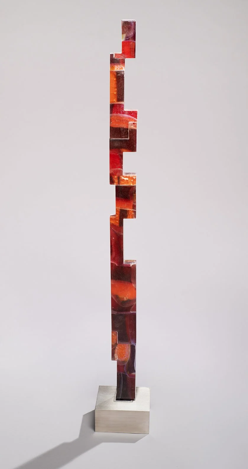 Kujenga 7
(44 1/2"H x 3"W x 1 3/4"D) set in a brushed stainless steel base (3"H x 6 1/2"W x 6 1/2"D)