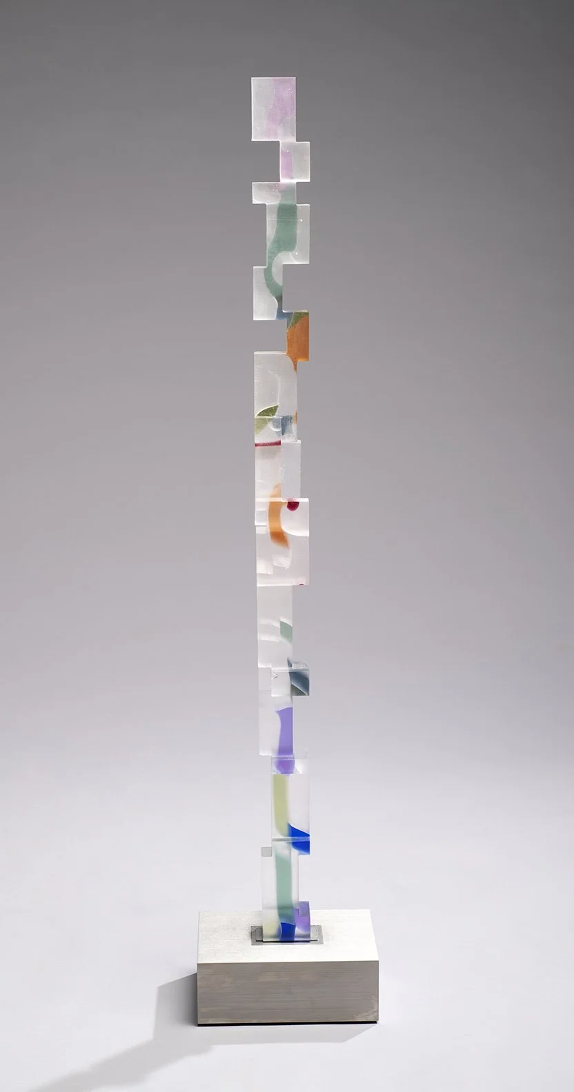 Kujenga 10 (43 ¼” H x 2 3/8” W x 2 14” D) set in a brushed stainless steel base ( 8 ½” W x 6 ½” D x 3” H)