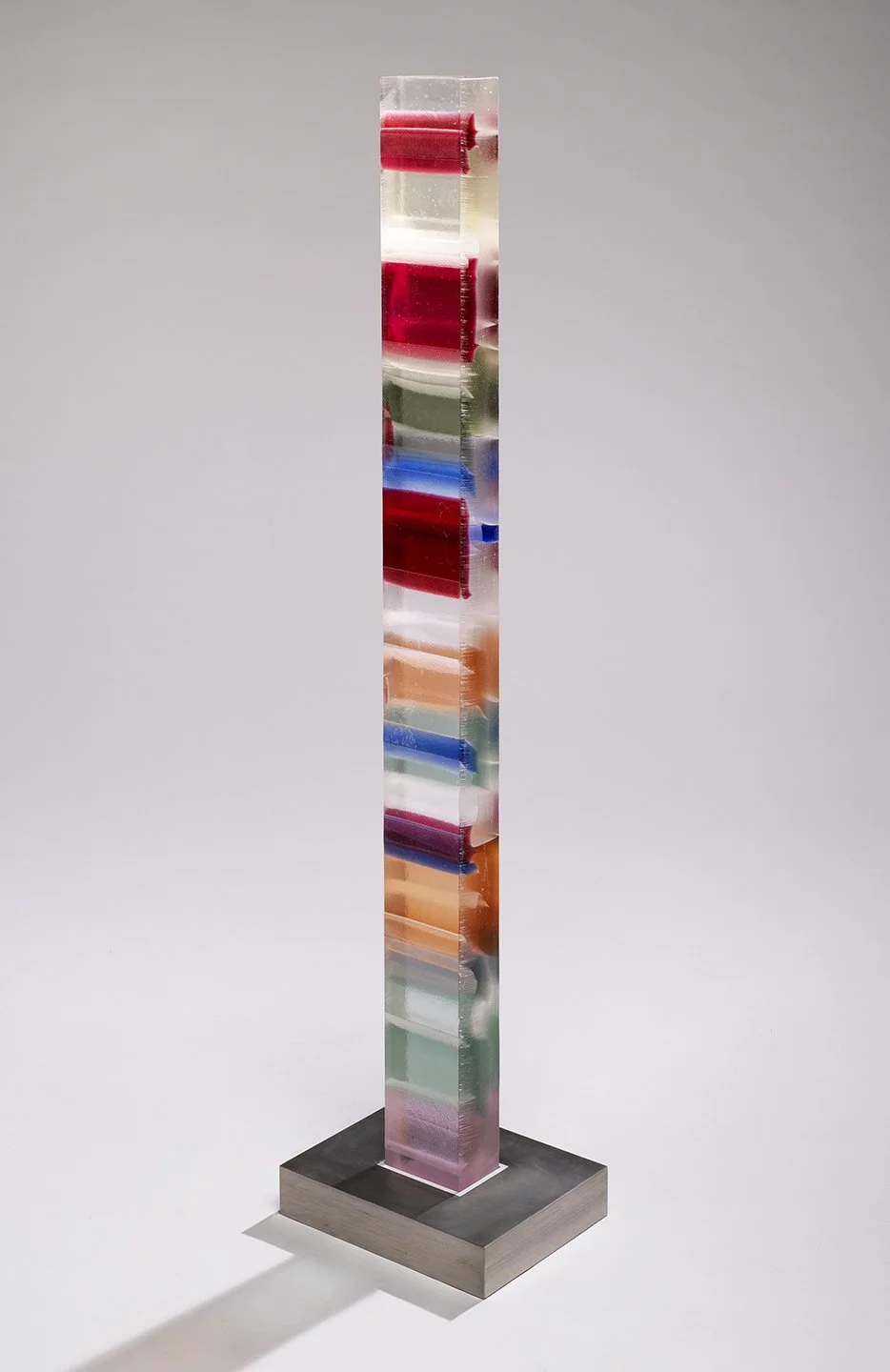 Spire 9 (44”H x 3 3/4” W x 2 5/8”D) set in a brushed stainless steel base (2”H x 10"W x 8” D)