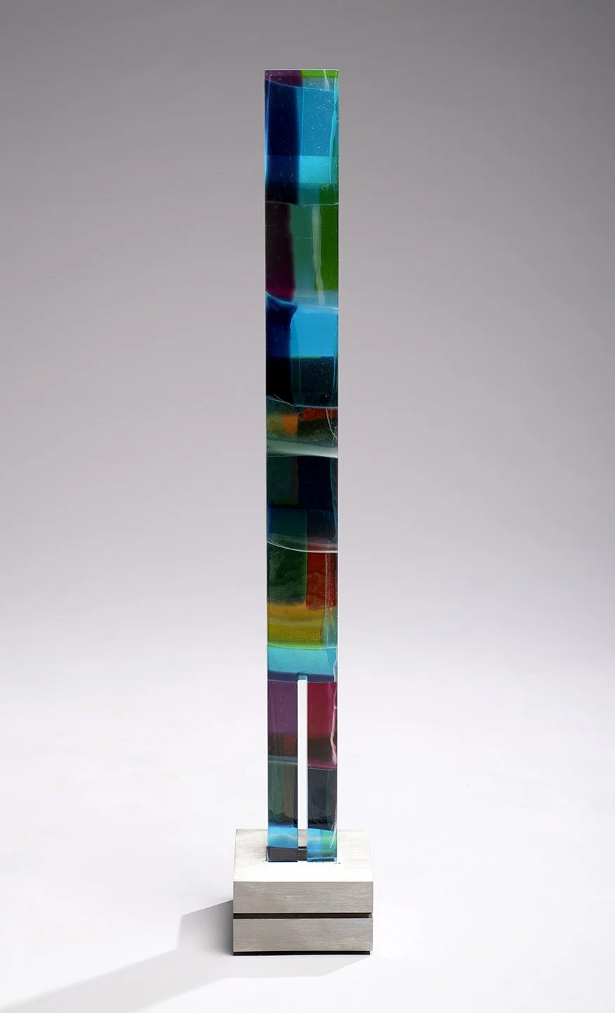 Spire 7 (35 ½”H x 3” W x 1 ¾”D) set in a brushed stainless steel base (5 ¾” W 5 5/8” D x 3 1/16” H)