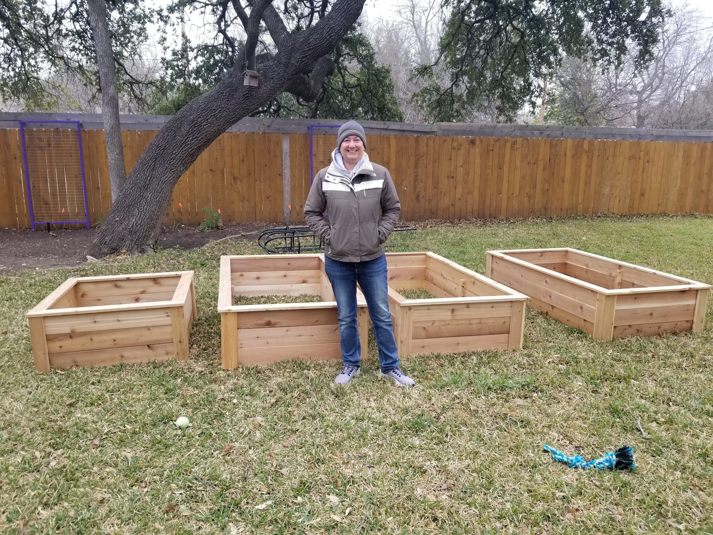 A quick pose next to the unfinished raised beds:)