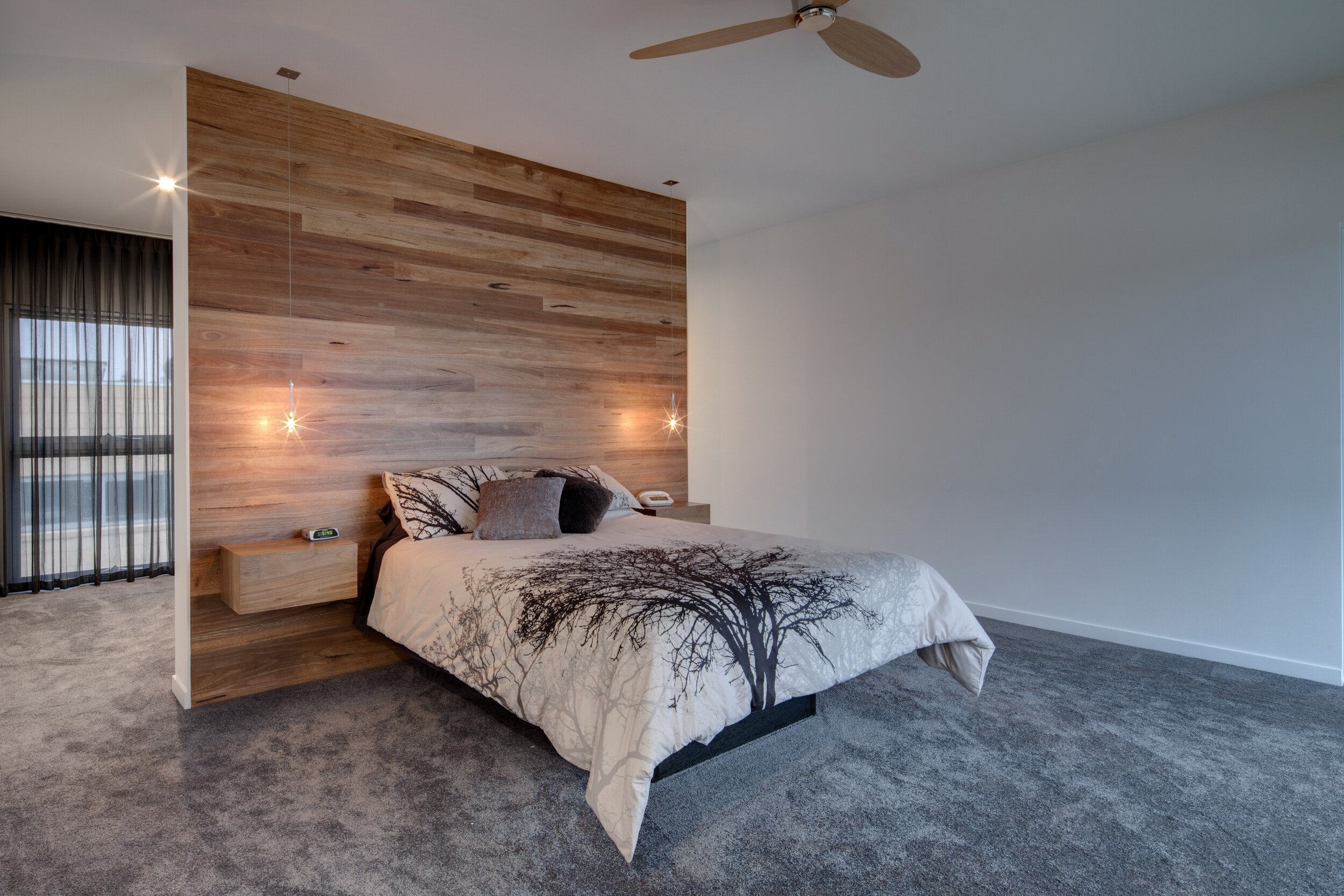 Contemporary styled bedroom with globe lighting.jpg