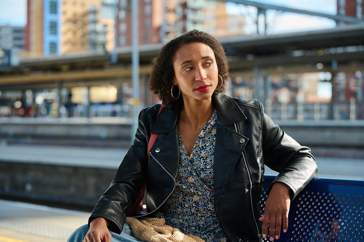 'Viv 1' from Small Talk Saves Lives sits on a platform bench
