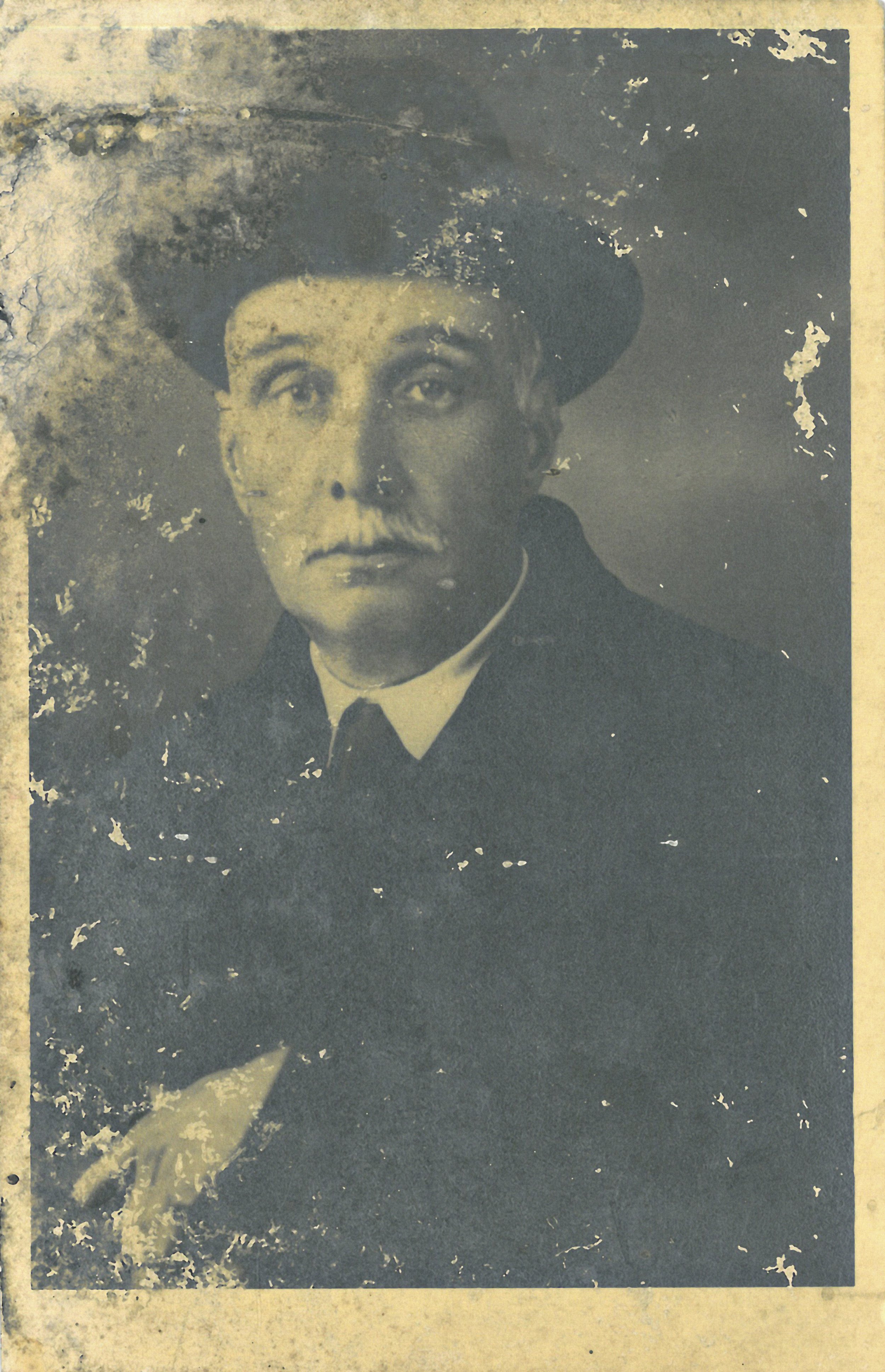 Vintage portrait of an older man wearing a hat