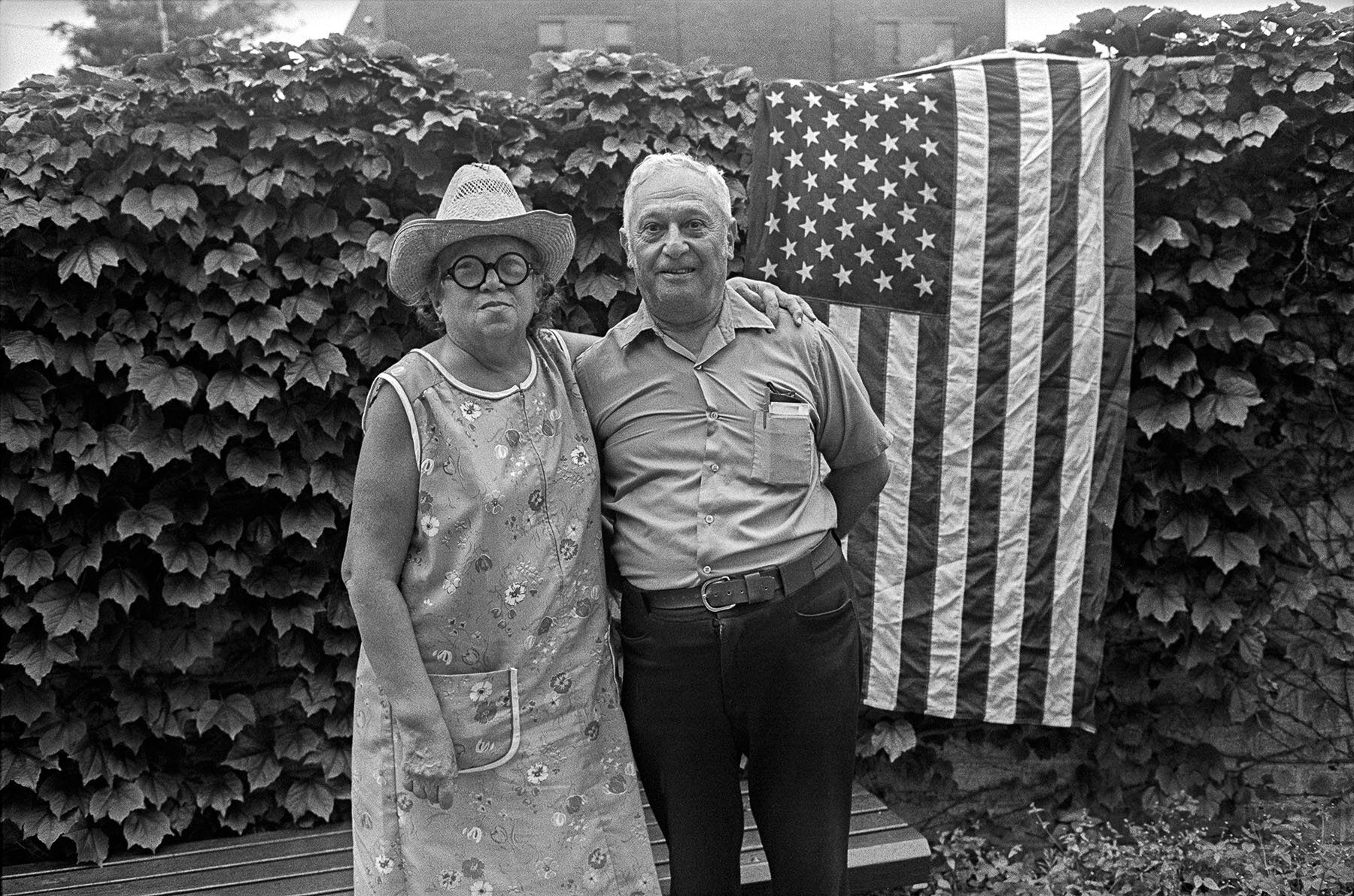 Couple with American flag, Coney island,  New York