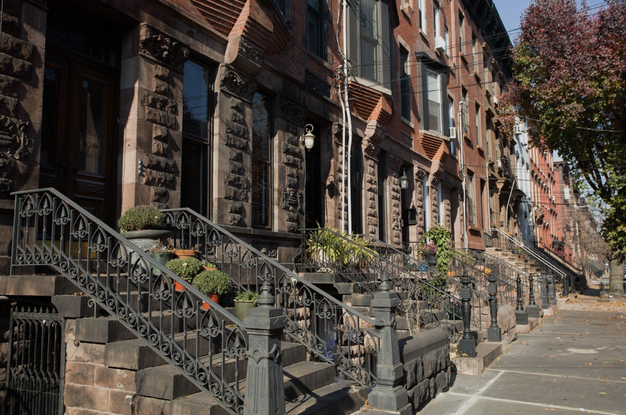 Classic Hoboken brownstone block with brick facades and front stoops