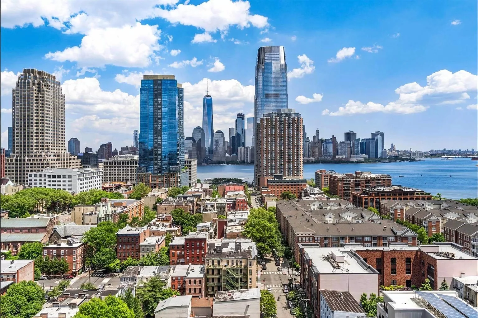 Residential streets and waterfront skyline in Jersey City with views of Lower Manhattan across the Hudson River