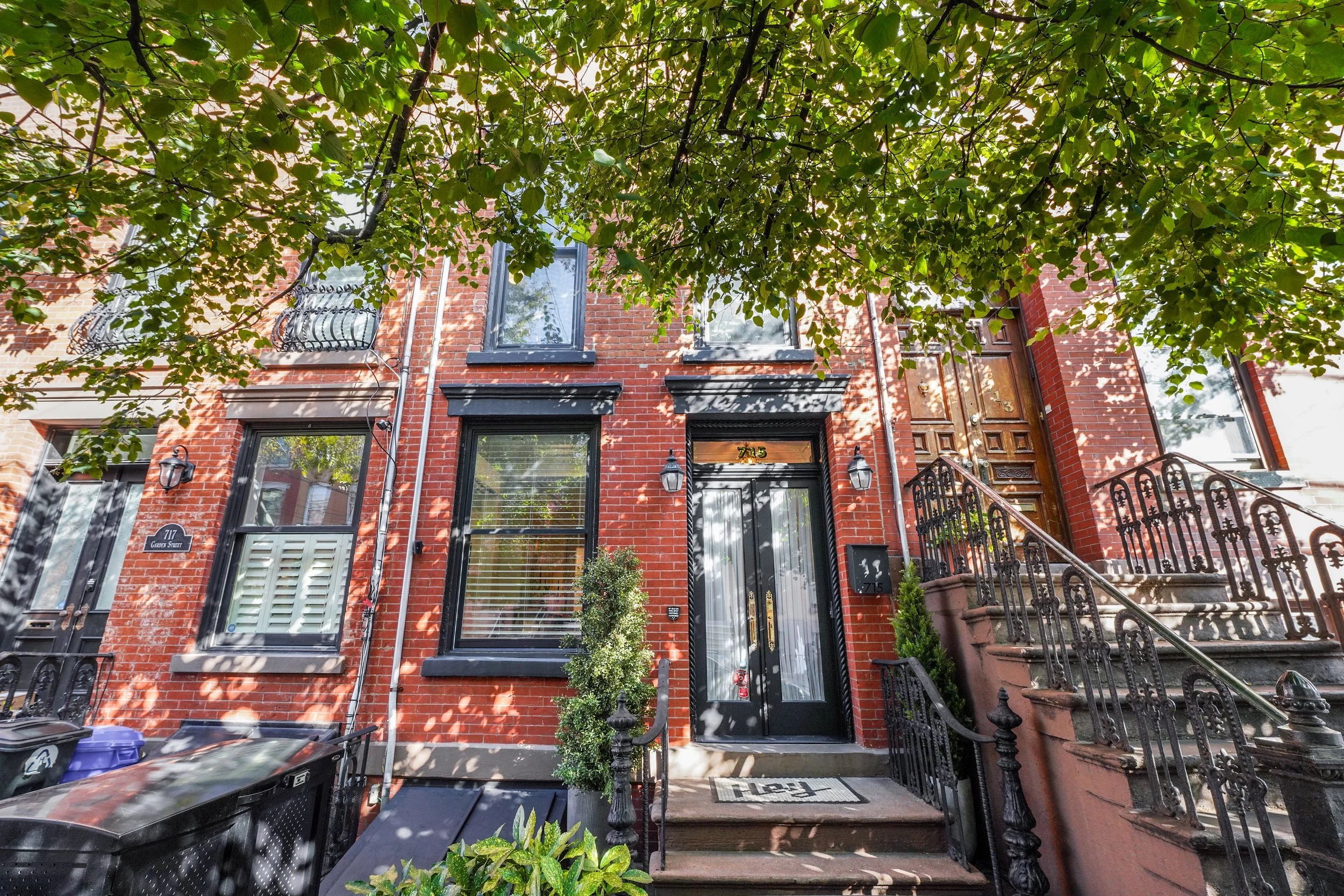 Hoboken brownstone exterior on residential street in the spring