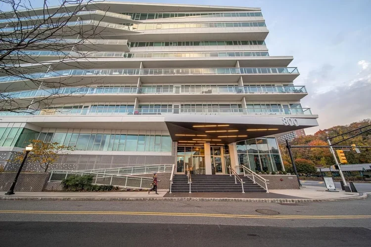 Modern glass condominium building at 800 Avenue at Port Imperial in Weehawken