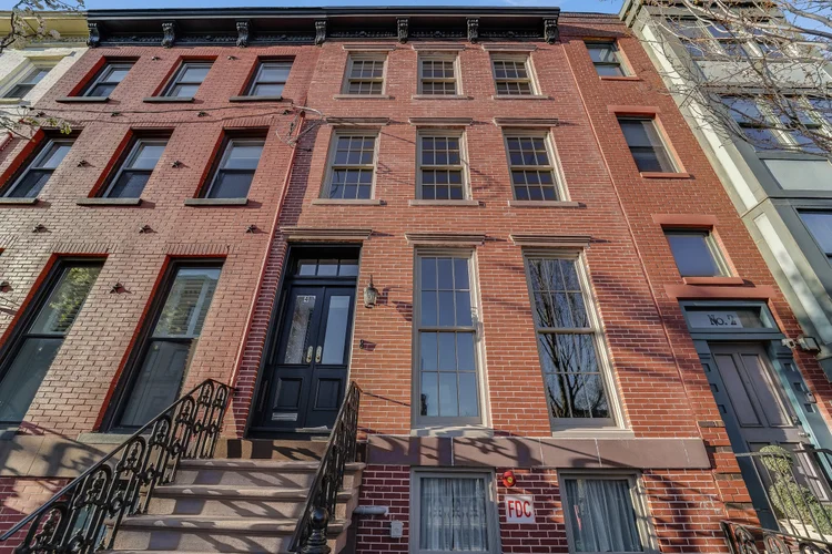 Red brick townhouse with a stoop at 4 Mercer Street in Jersey City