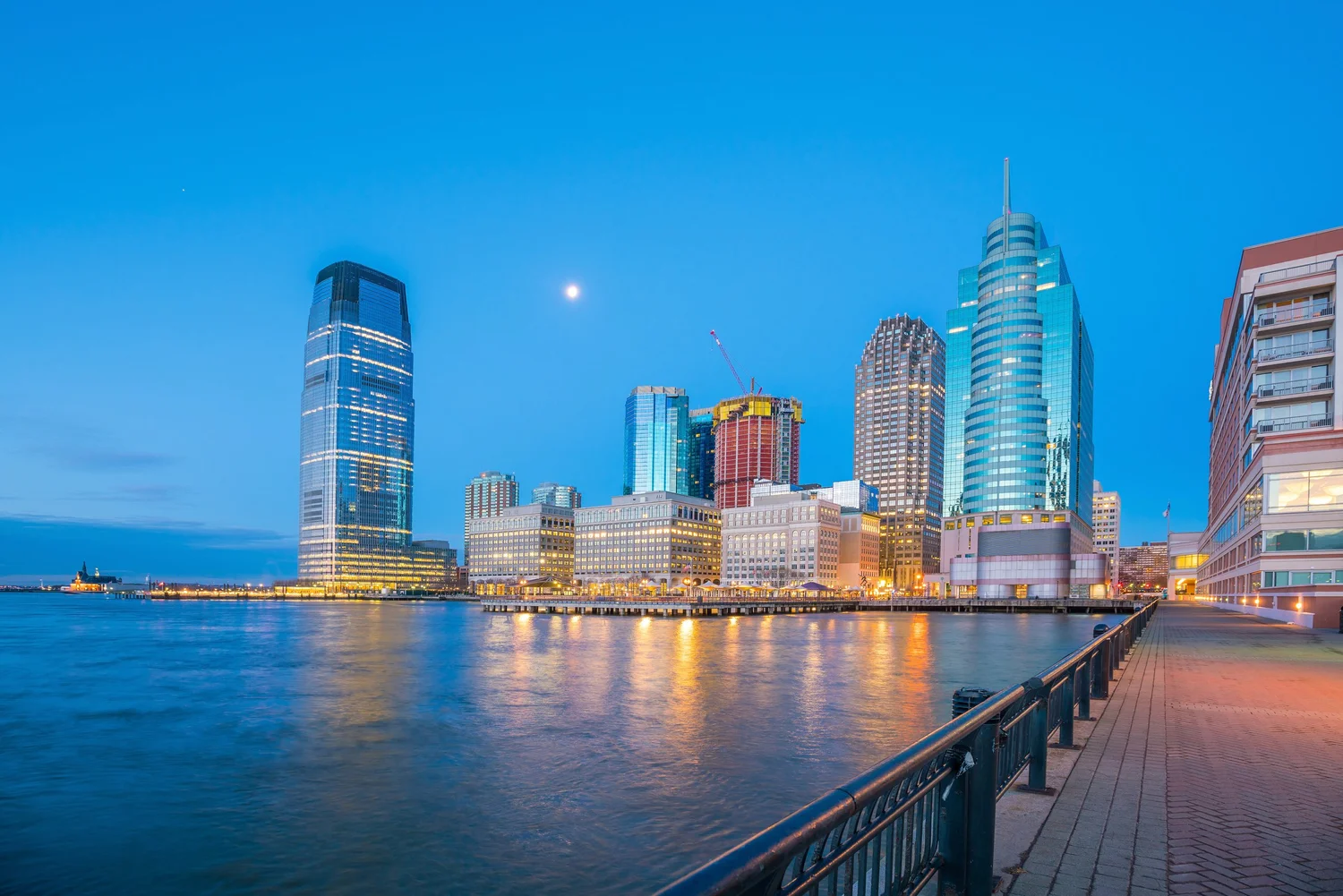 Jersey City NJ waterfront at dusk with Manhattan skyline