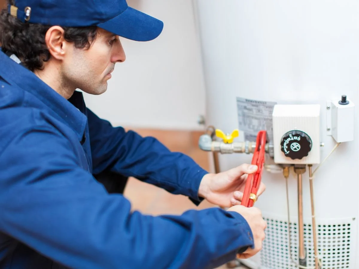 plumber doing water heater repair