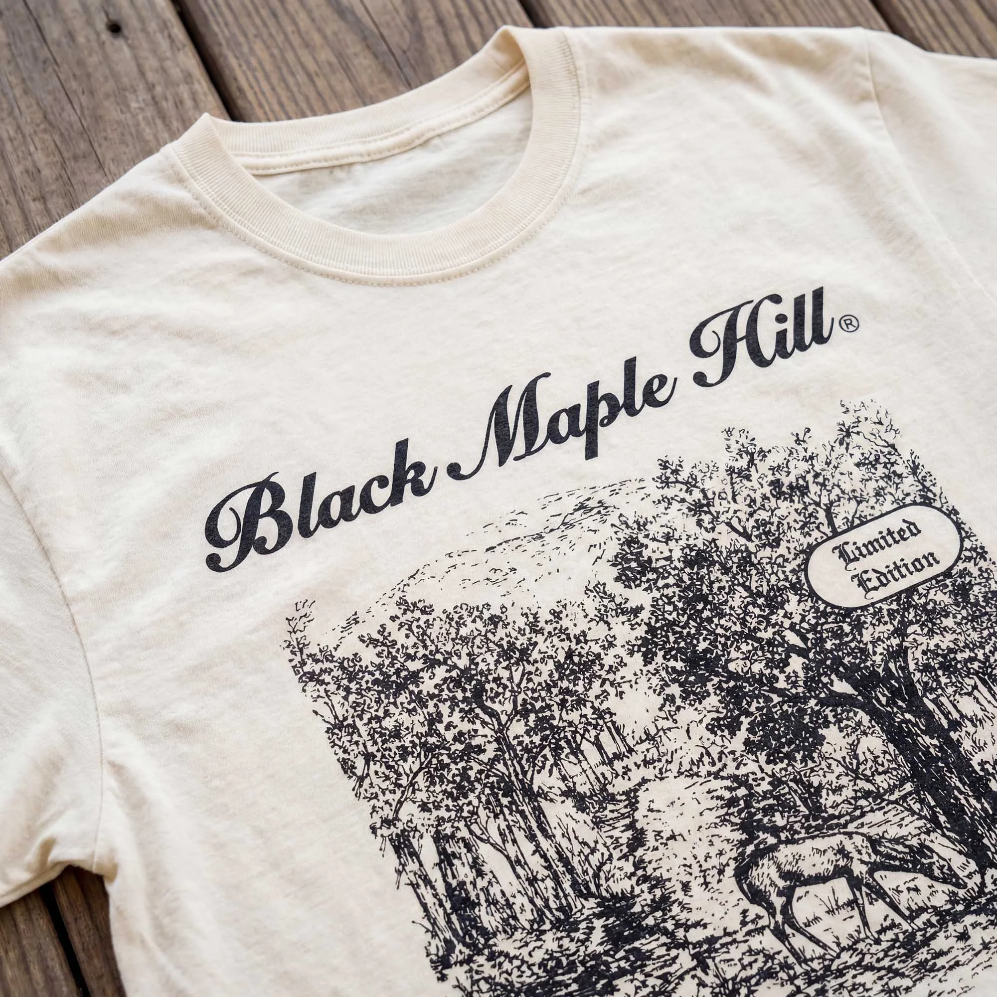 20260212_BMH_Merch_BaseTshirt_IvoryShirtBlackPrint_Shop_3.jpeg