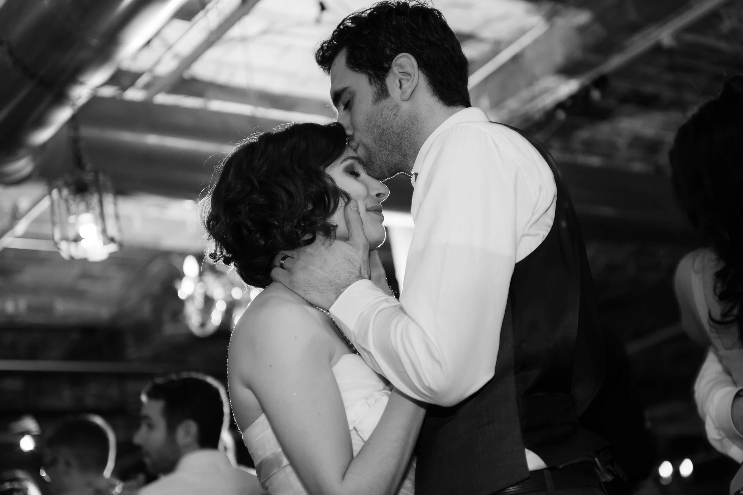 Documentary wedding photograph capturing an emotional moment between partners