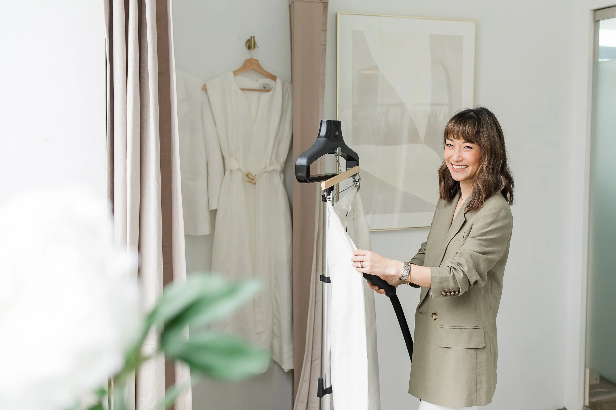 Professional steaming of a refined white garment in a tailored care setting