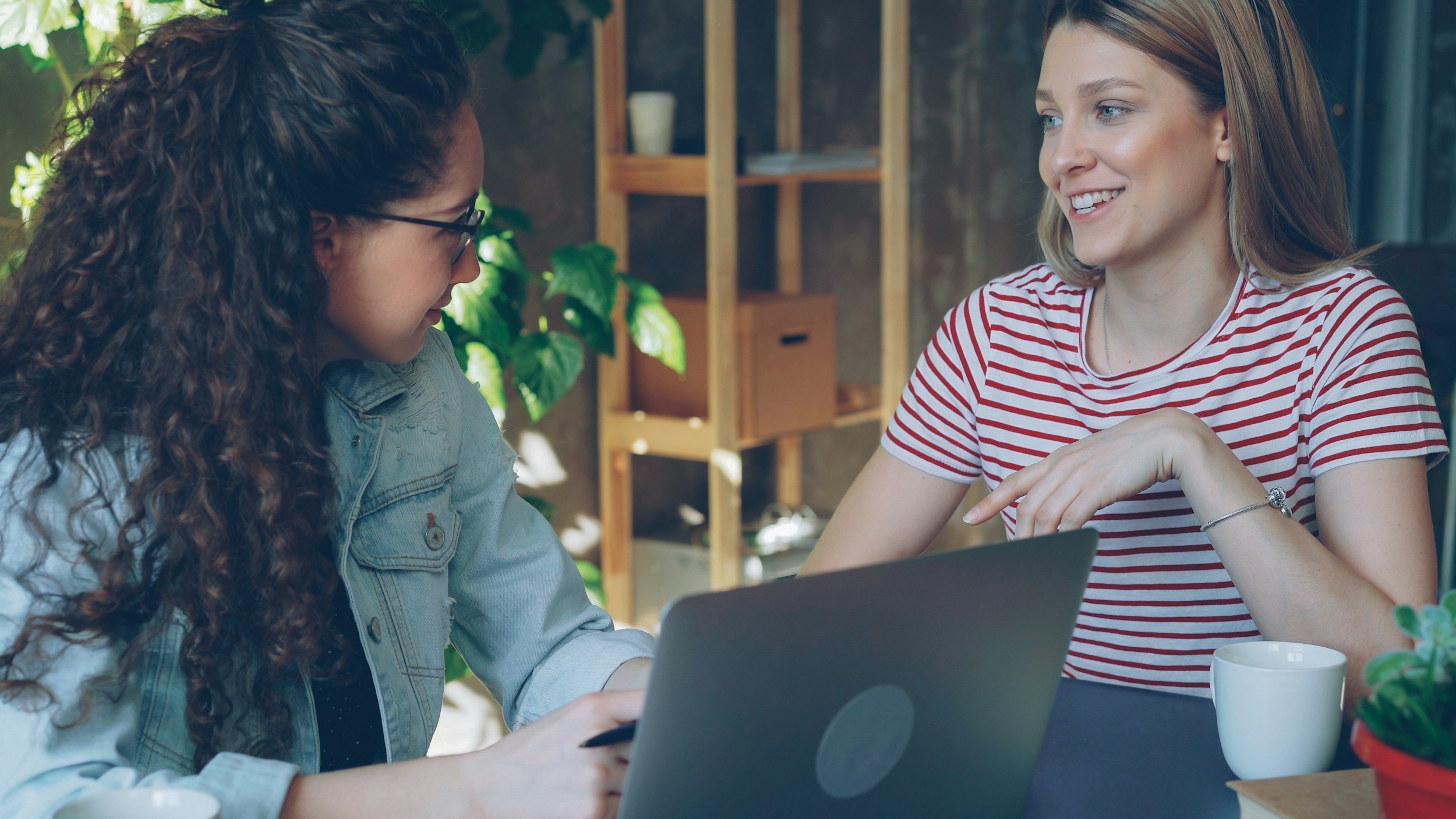 Professional woman engaged in thoughtful work, representing clarity and collaborative leadership