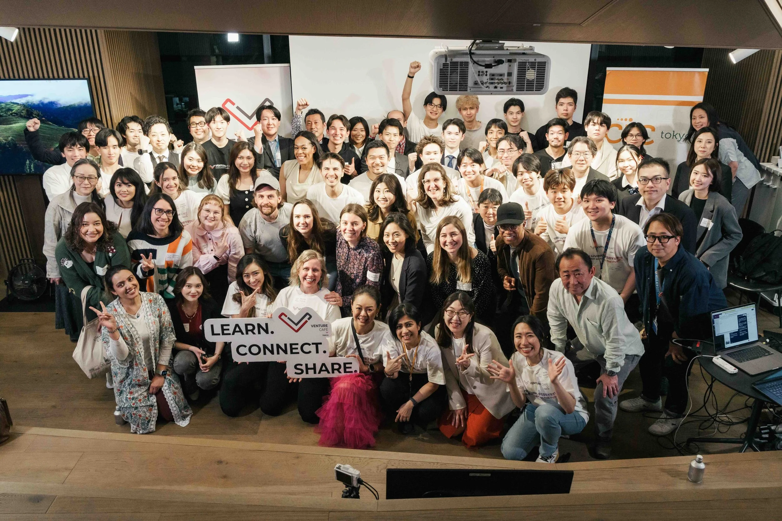a group of attendees pose for a photo after a networking event