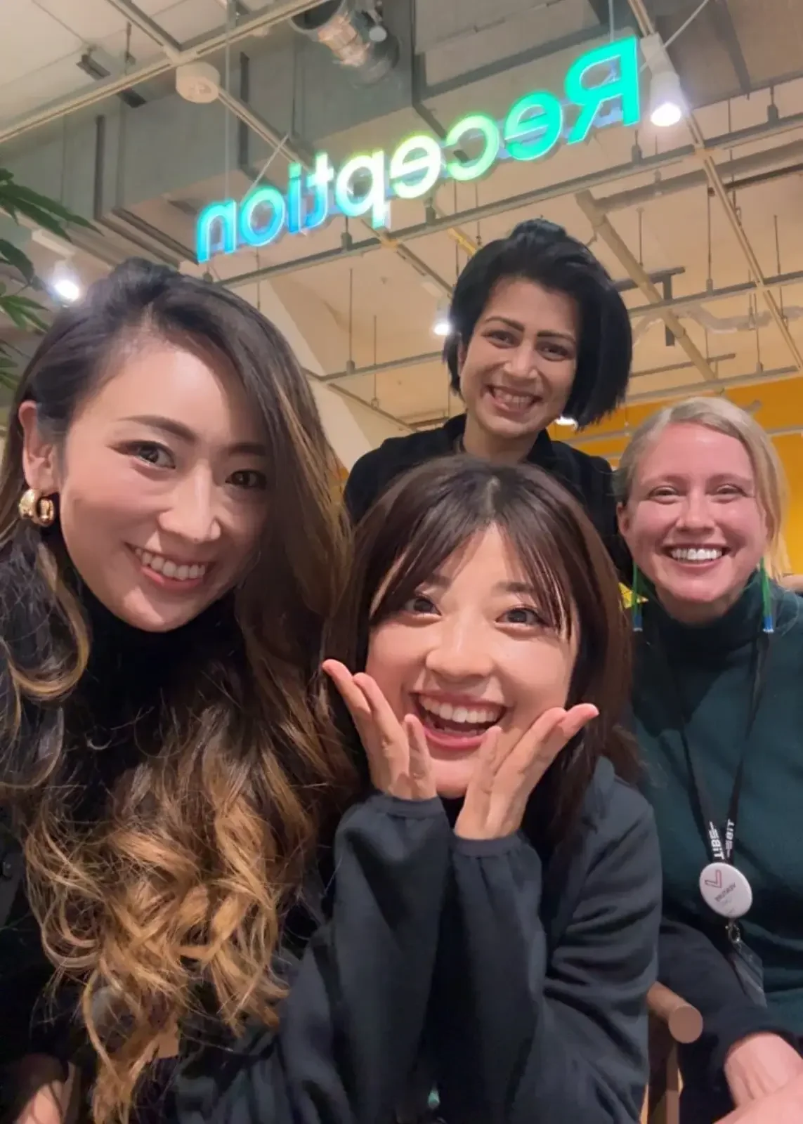 Heather Dobbin with Tokyo Innovation Base colleagues at reception area, smiling together as a close-knit innovation and community team in Japan