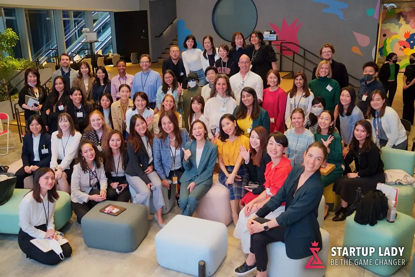Heather Dobbin with attendees at a Startup Lady Japan community event in Tokyo, group photo in a modern lounge venue