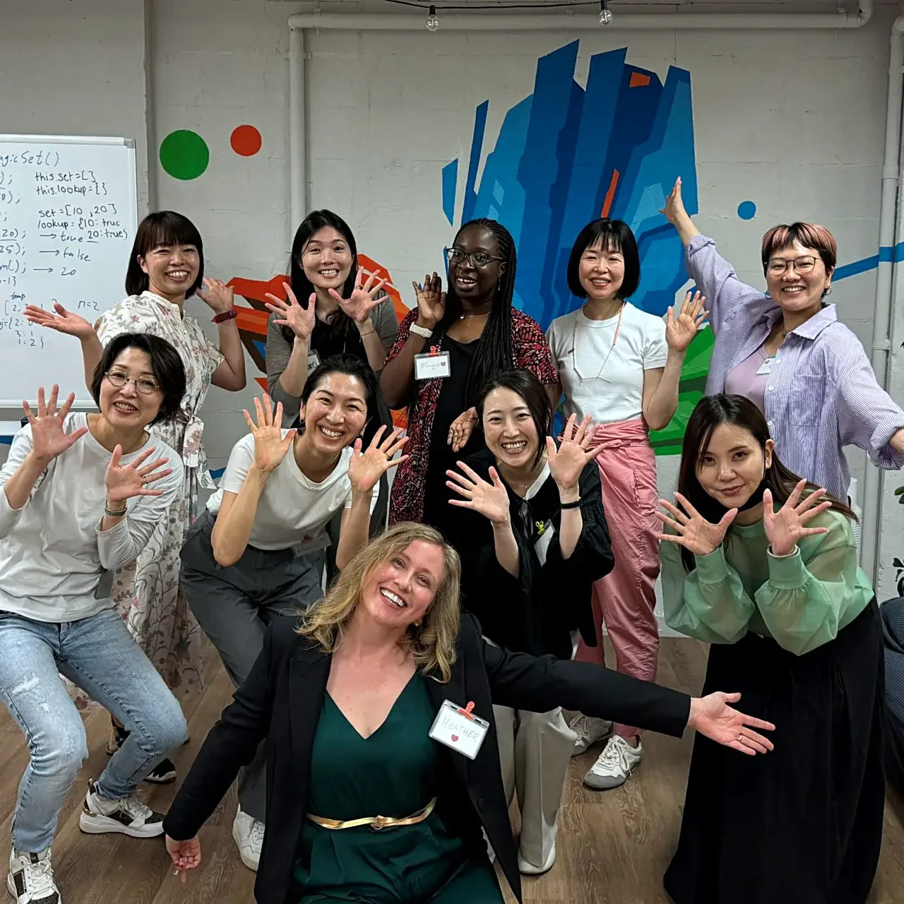 Heather Dobbin with Sasuga Communications workshop participants in Japan, group photo after a community training session