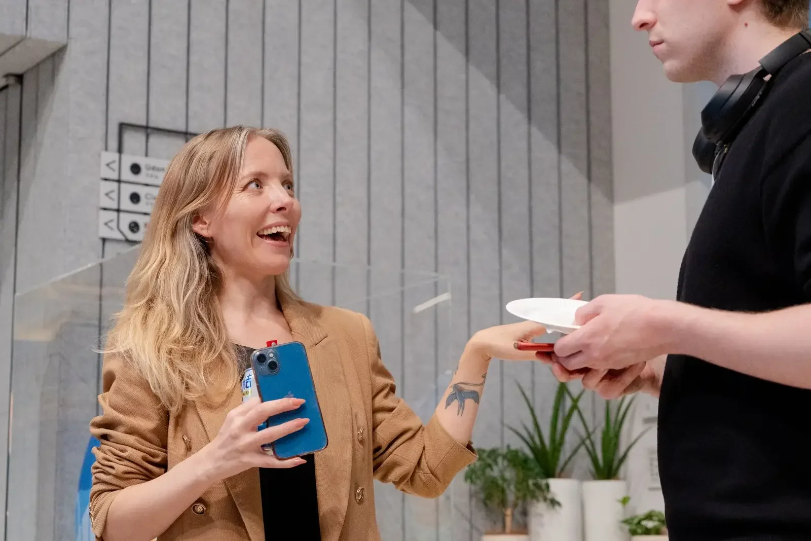 Katie Marple speaking with an attendee at a community event, co-facilitator of a women-only mindfulness hike and picnic in Zushi, Japan