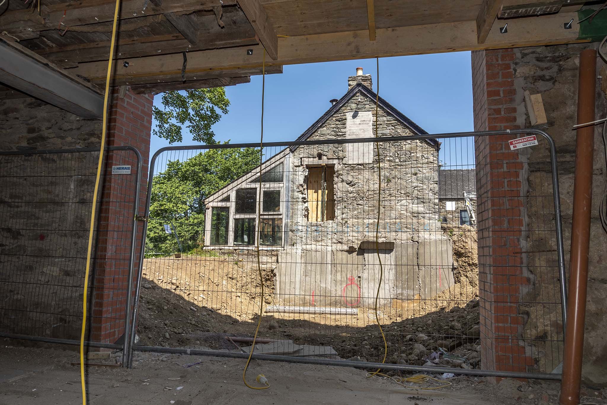  The excavation of the site of the Collection Store seen through a new entrance in the wall of the old Museum Gallery. 