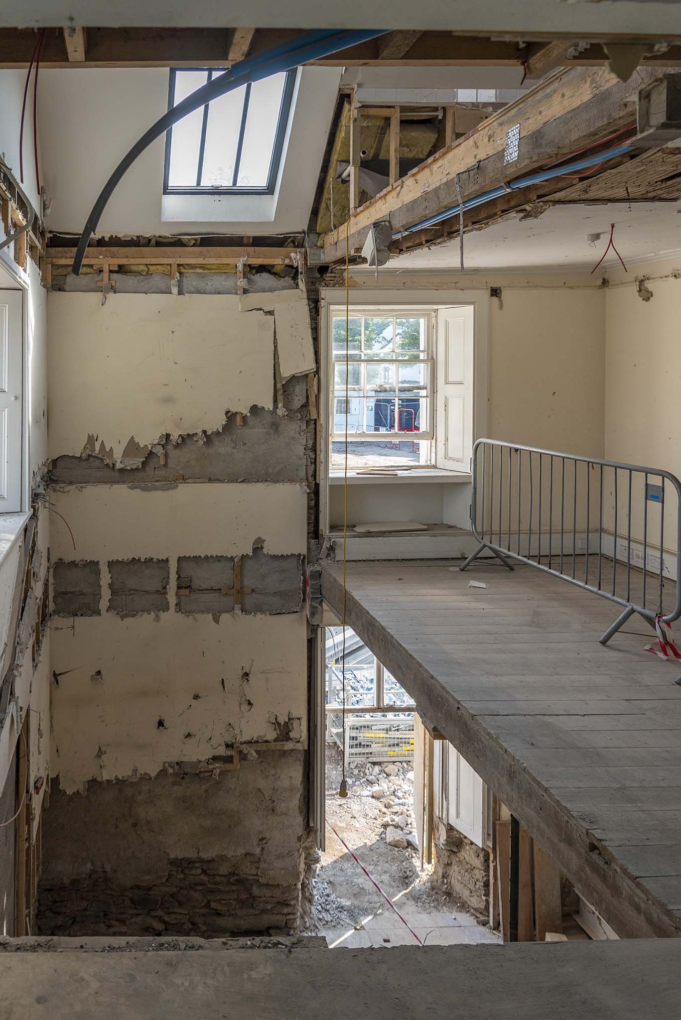  The fire escape is removed from the old offices, part of which will become a lift shaft. 