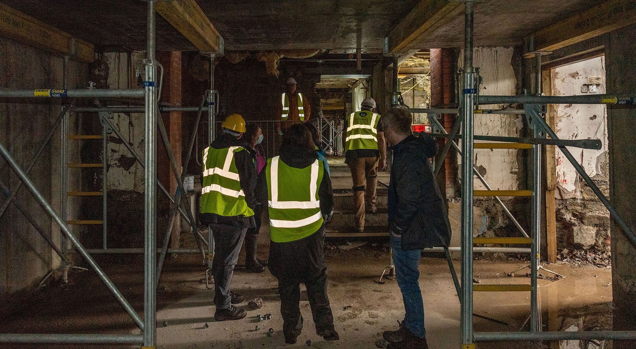 Museum staff explore the interior of the future Collections Store. 