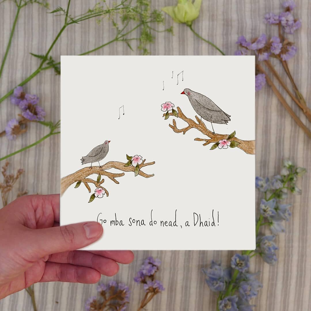 A Father&rsquo;s Day card as Gaeilge featuring one small and one large blackbird, possibly singing beautifully with each other, possibly having a shouting match in the blossom trees - how are we to know?

The caption reads &lsquo;Go mba sona do nead,