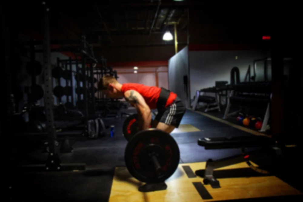 Young athlete lifting a barbell
