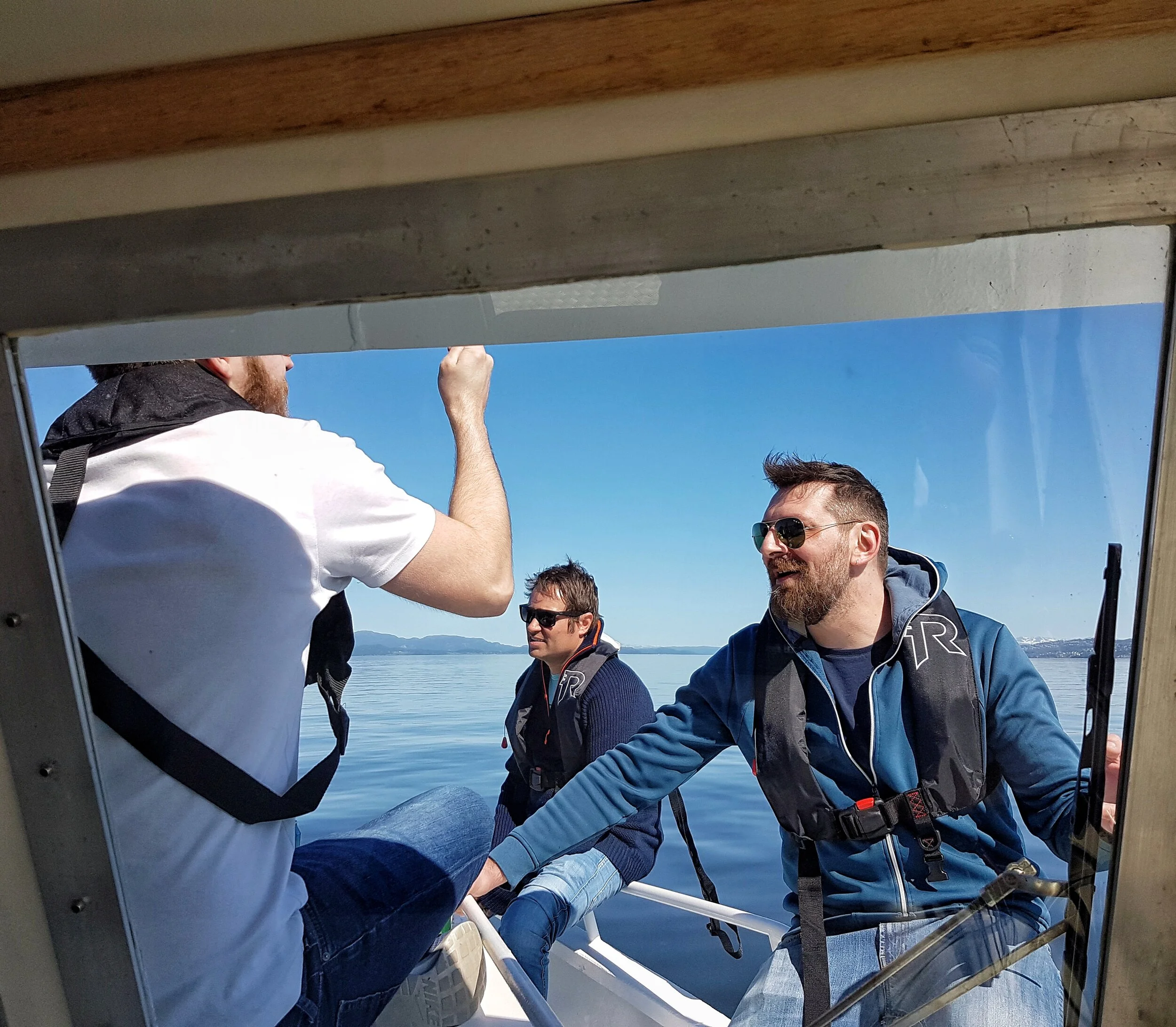 men talking group ranja frontend blue sky fjord.jpeg